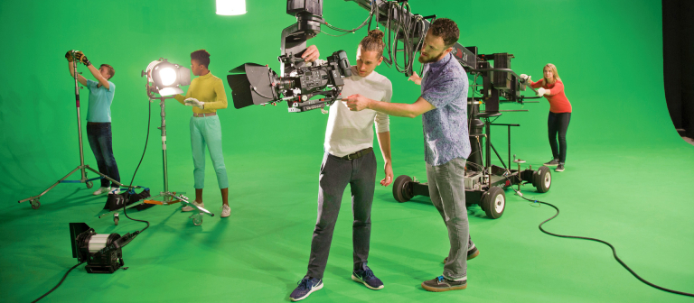 Film and television students working in green screen studio