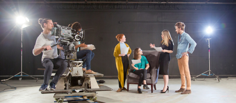 Performing arts students acting on camera Performing arts professor instructing on film and television set