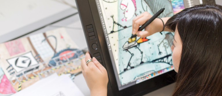 Themed entertainment design student drawing on Cintiq