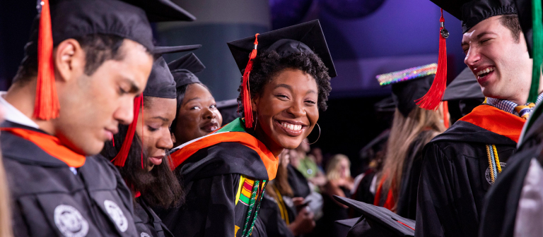 Smiling graduate at SCAD Savannah commencement