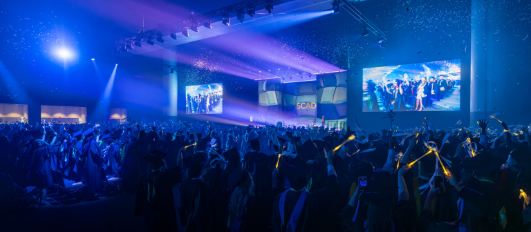 SCAD graduates celebrating at commencement