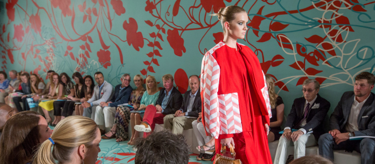 Model walking runway at SCAD Fashion Show