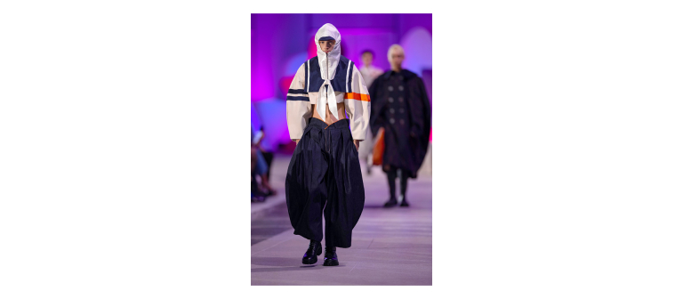 Model walking runway at SCAD fashion show