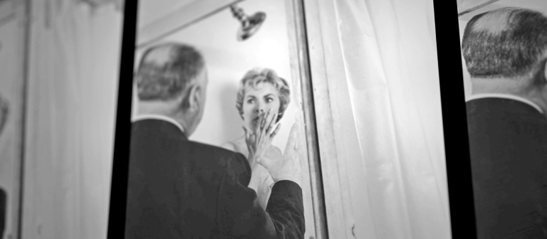 Alfred Hitchcock provides guidance to Vera Miles on set of Psycho