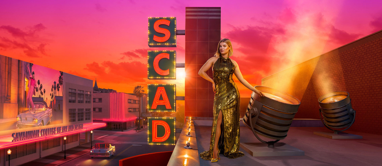 Woman in gold dress on marquee 
