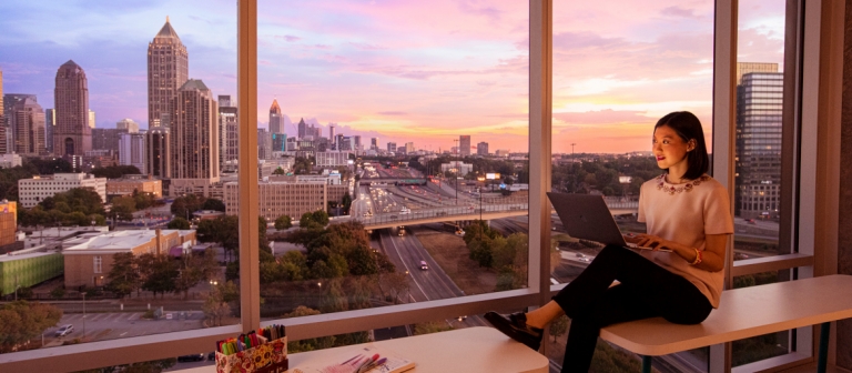 SCAD student studying with view of skyline