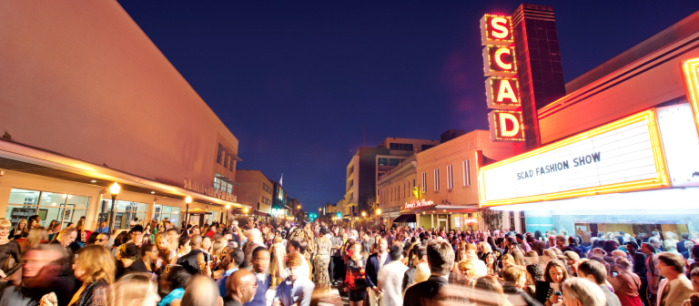 Event attendees gathering outside Trustees Theater