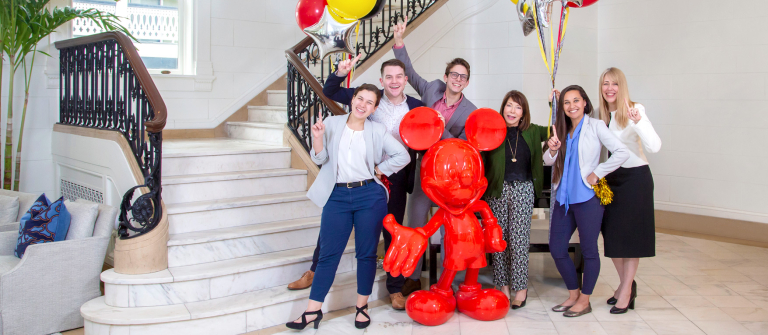 Students, faculty and SCAD president celebrating Disney Imagineering win