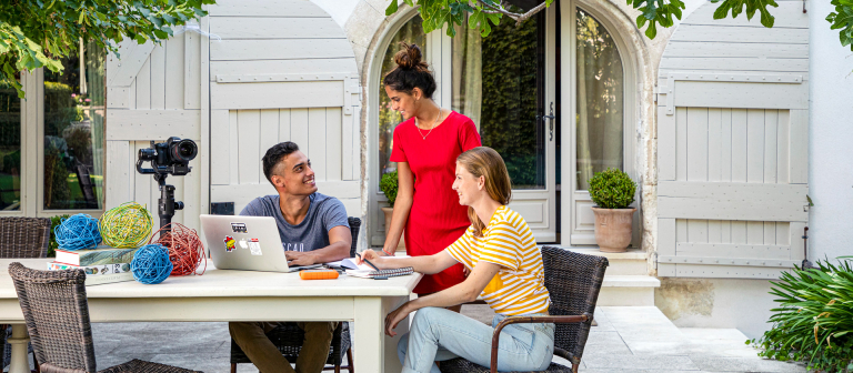 eLearning students collaborating at a table
