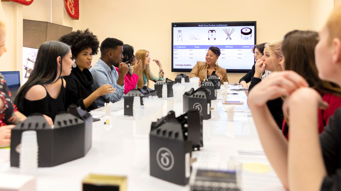 Business of beauty and fragrance students listen to a professor in a Savannah classroom
