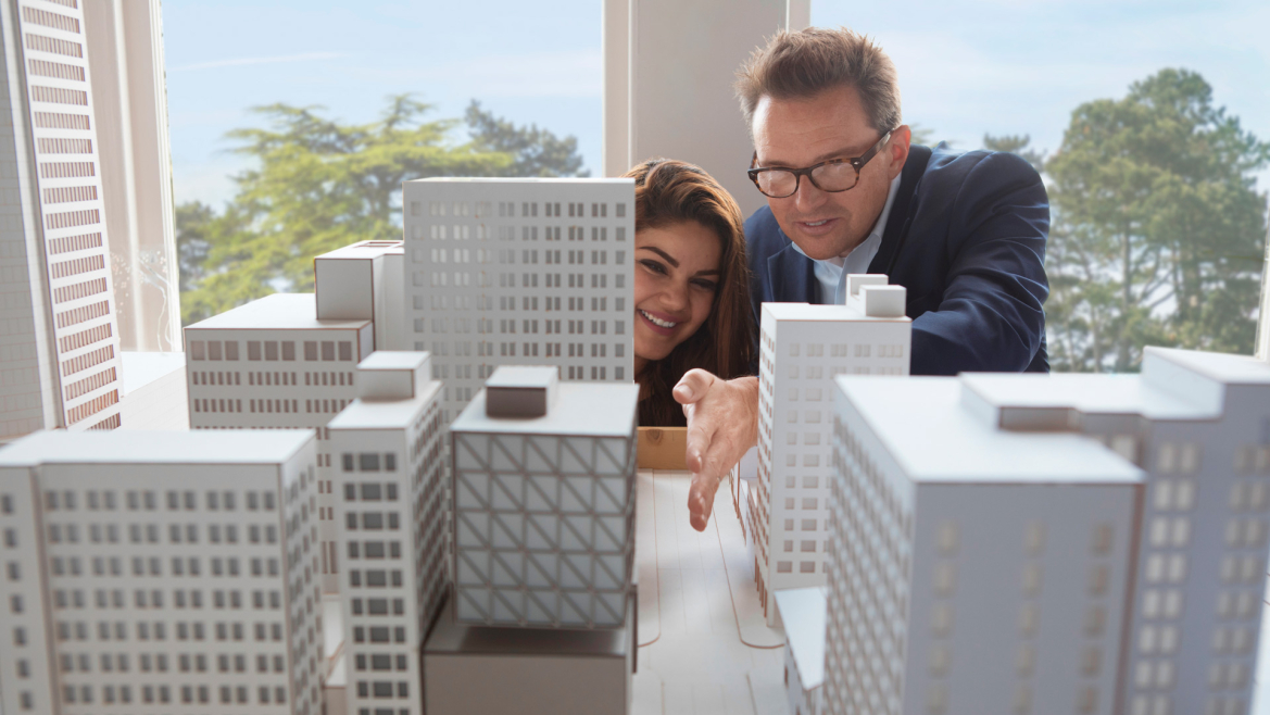Urban design student and professor examine a model