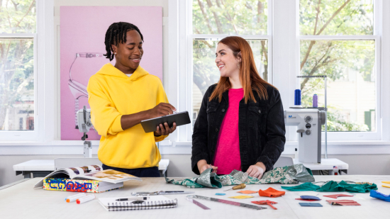 Two SCAD Savannah Rising Star students in a workspace