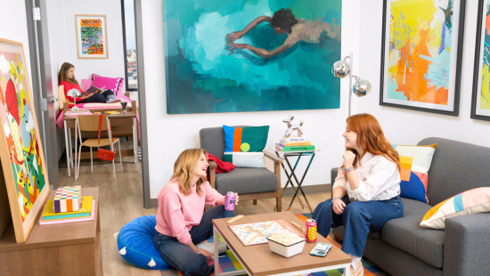 Students lounging in River dorm room