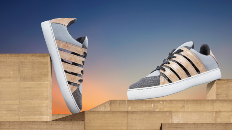 Sneaker design by Hannah Mokoski showing two shoes positioned on wooden blocks