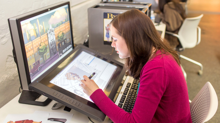 Animation student working in computer lab Animation student drawing on Cintiq in computer lab