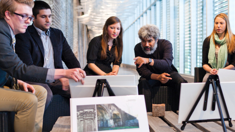 Architecture students reviewing work with artist Fred Wilson at SCAD Museum of Art