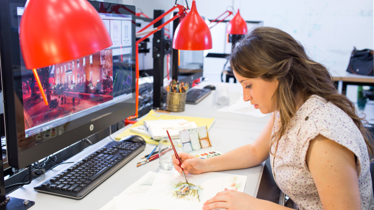 Architecture student illustrating with watercolor in hybrid lab