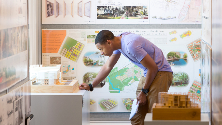 Architecture student viewing NAAB exhibit Architecture student viewing NAAB exhibit