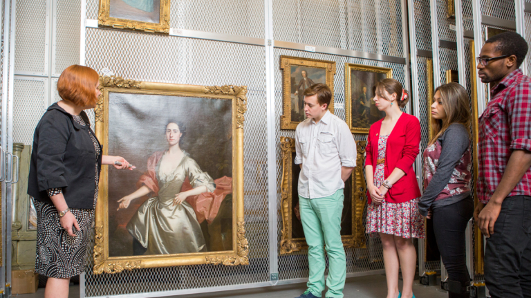 Art History professor giving lecture on paintings in the SCAD Museum of Art