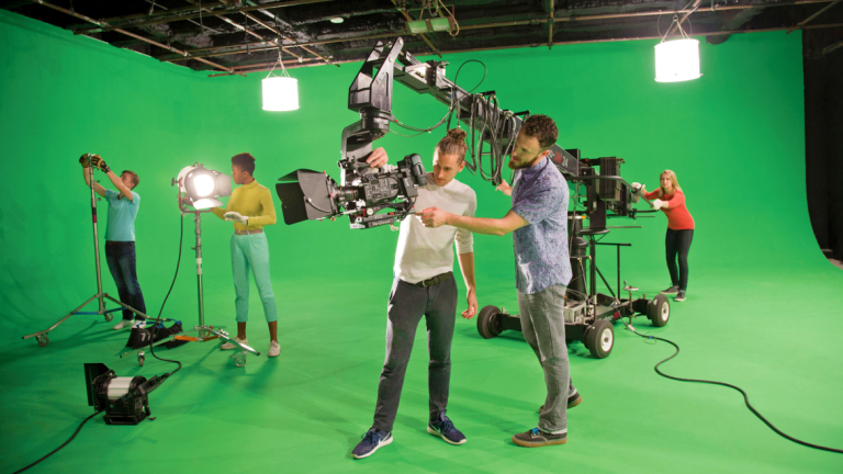 Film and television students working in green screen studio