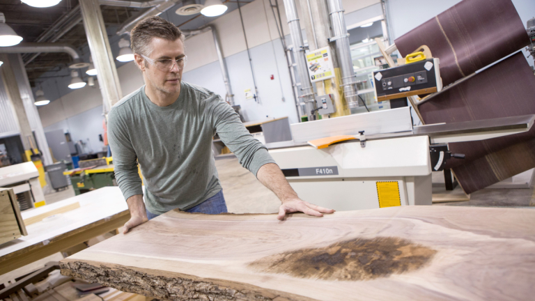 Furniture design student in woodworking studio at Gulfstream Center for Design