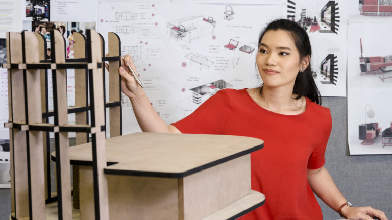 Furniture design student works on project