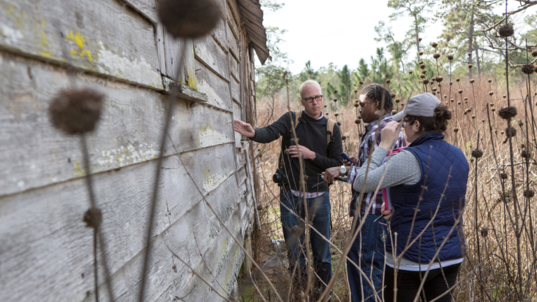 Preservation design class studying in the field SCAD preservation design class examining old structure