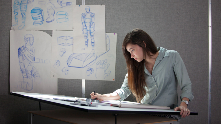 Industrial design student sketching in studio