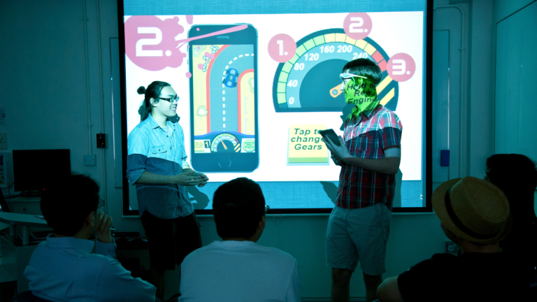 Interactive design and game development students giving demonstration Interactive design and game development students giving demonstration