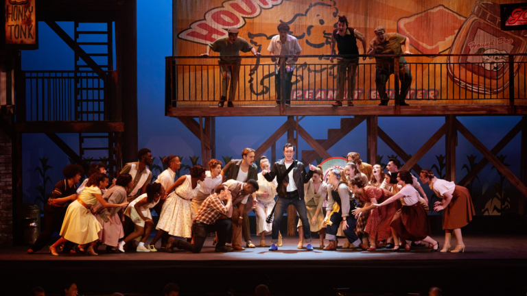 Students on stage during "All Shook Up" musical rehersal