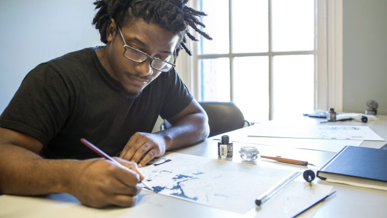 Sequential art student inking comics Sequential art student inking comics