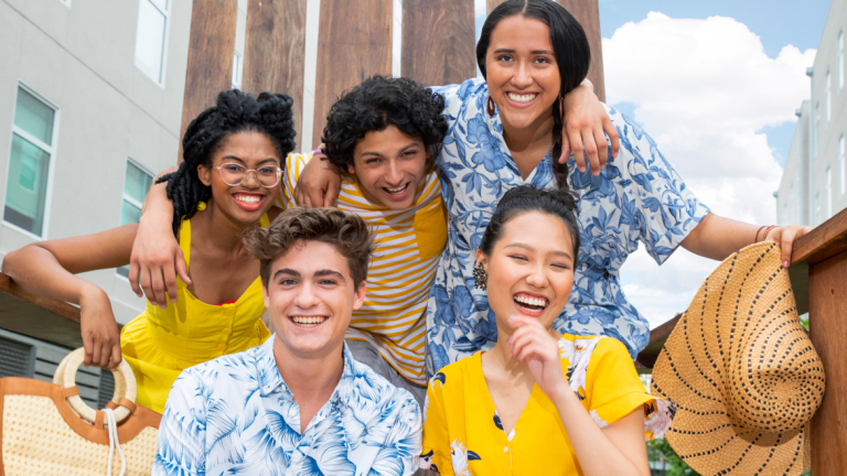 SCAD Rising Star students pose in yellow and blue shirts