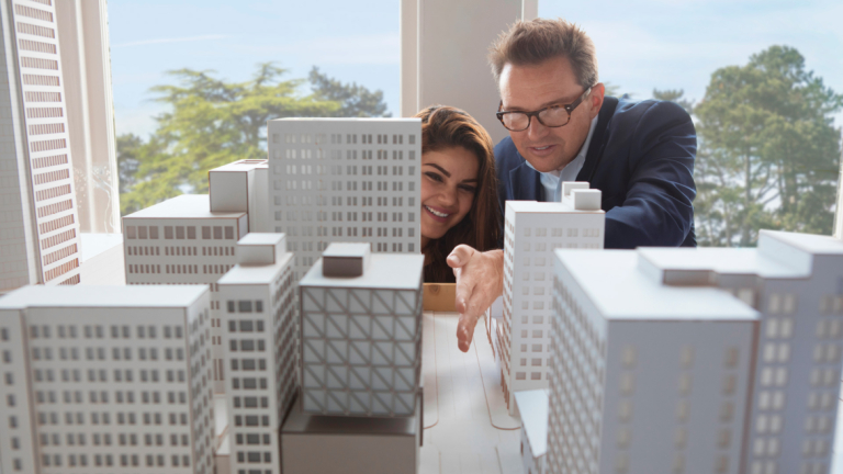 Urban design student and professor examine a model