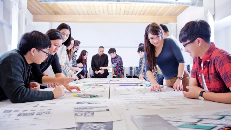 User experience design students collaborate in the classroom