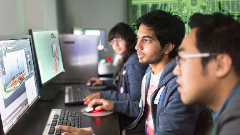 Visual effects students collaborating in computer lab at Montgomery Hall