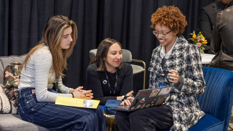 Student shows off their portfolio at the annual Career Fair