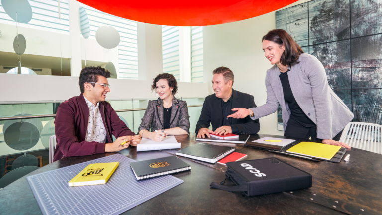 Students and faculty work on a project for Lenova through SCADpro