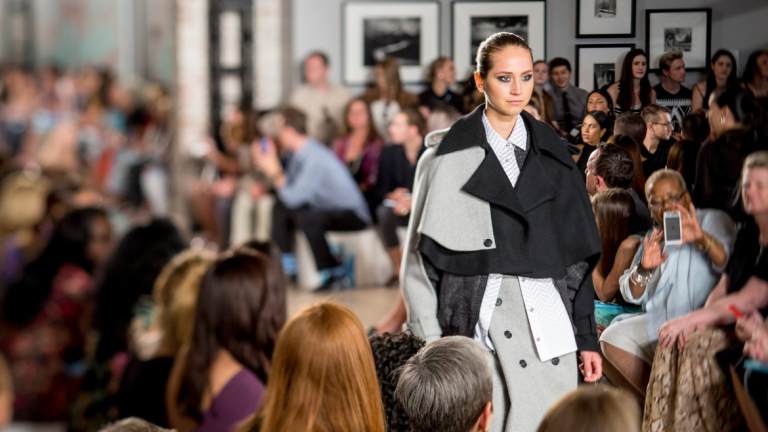 Model walking runway at SCAD Fashion Show