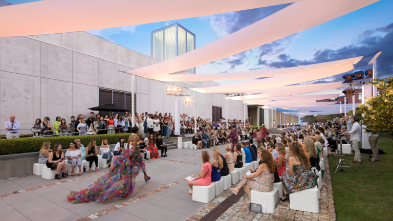 Model walking runway at Savannah fashion show at scad museum Model walking runway at Savannah fashion show at scad museum