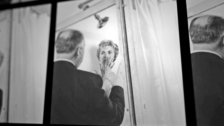 Alfred Hitchcock provides guidance to Vera Miles on set of Psycho