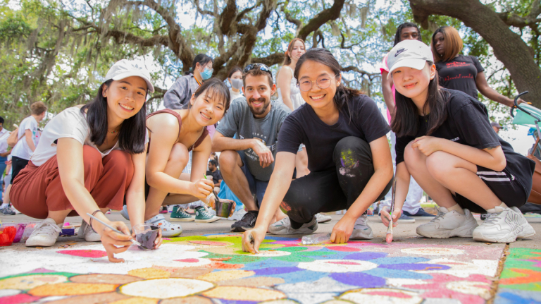 Smiling students at Sidewalk Arts Festival