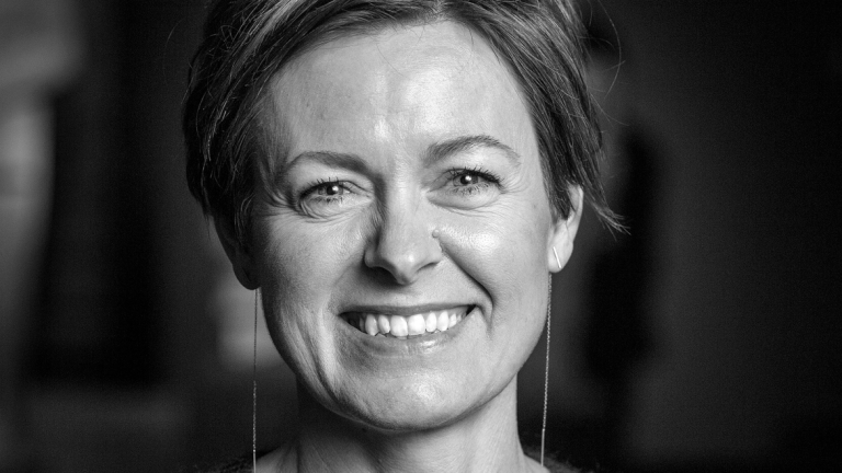 black and white portrait of Trine Sondergaard smiling