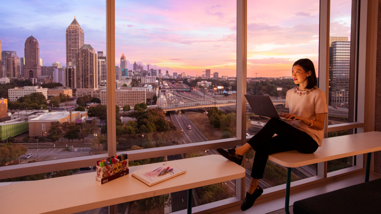 SCAD student studying with view of skyline