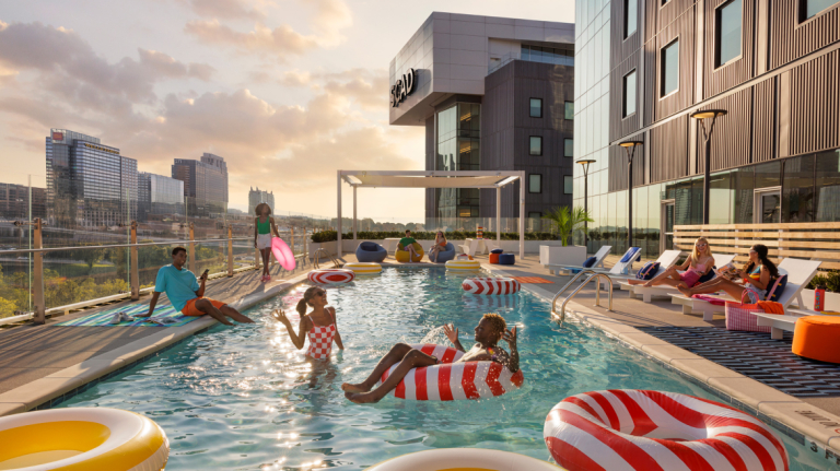 SCAD students sitting poolside at FORTY FIVE