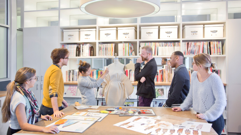 Fashion students participating in muslin critique in Eckburg Hall