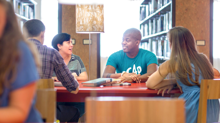 SCAD students talk at table in Jen Library