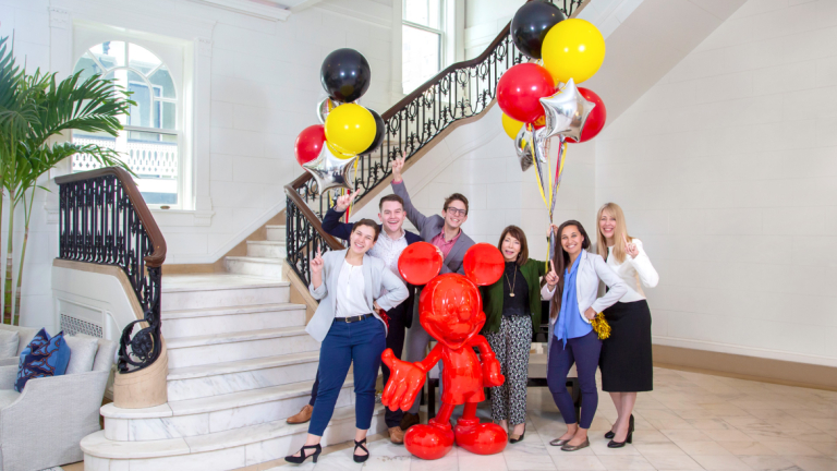 Students, faculty and SCAD president celebrating Disney Imagineering win