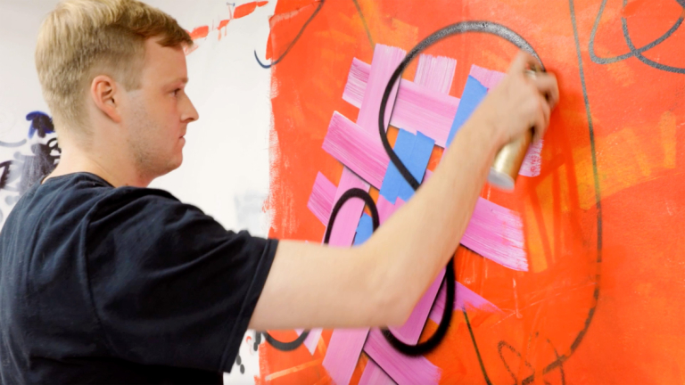 Play video of painting alumnus Daniel Byrd creating SCAD catalog cover