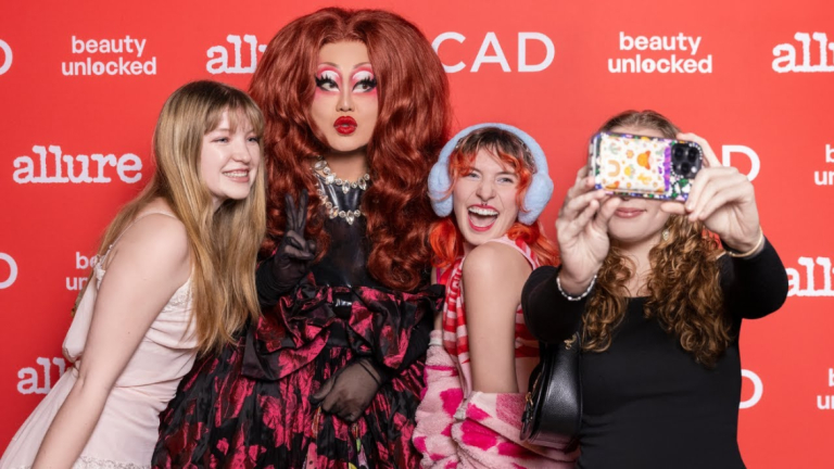Event guest and students take a selfie