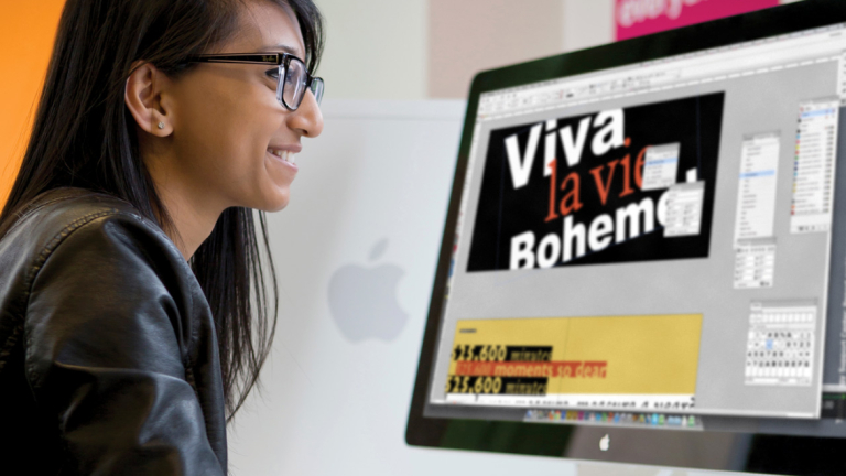 Advertising student using computer to create work